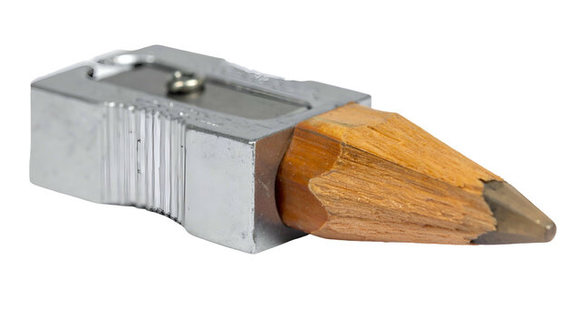 A close-up view of a metal pencil sharpener with a wooden pencil inserted, ready to be sharpened