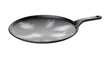 A black frying pan with a reflection of the sky and clouds