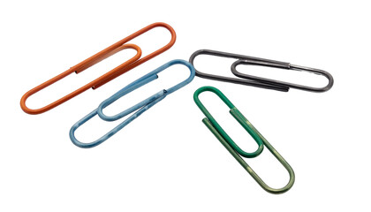 Four colorful paperclips of varied shades against a black background, scattered, close-up view