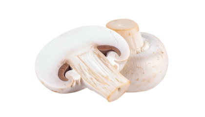 Two fresh white button mushrooms, one sliced open, isolated on a solid black background