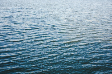 Close-up view of blue-grey water with small ripples and waves.