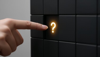"Finger pointing at illuminated question‑mark button in black control grid"