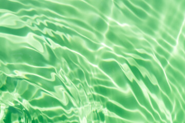 Close-up of the clear mint green water surface