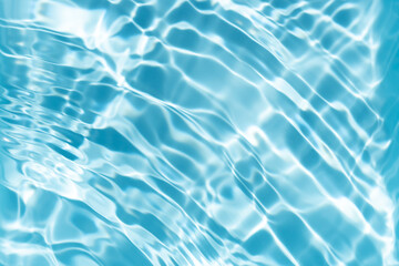 The surface of the water is clear and blue with ripples