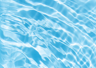 The surface of the water is clear and blue with ripples