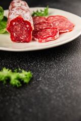 Dry sausage slice pork less fat jamon cured meat natural product tasty snack fresh delicious gourmet food background on the table rustic top view copy space