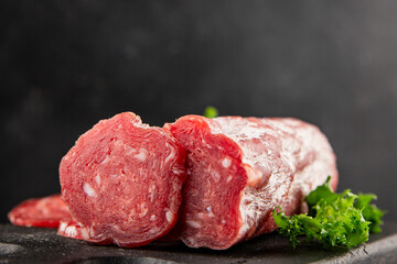 Dry sausage slice pork less fat jamon cured meat natural product tasty snack fresh delicious gourmet food background on the table rustic top view copy space