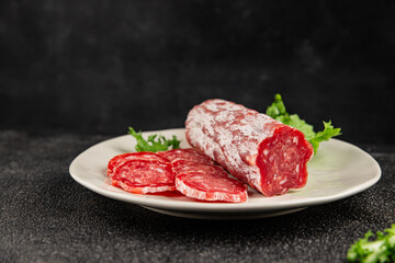 Dry sausage slice pork less fat jamon cured meat natural product tasty snack fresh delicious gourmet food background on the table rustic top view copy space