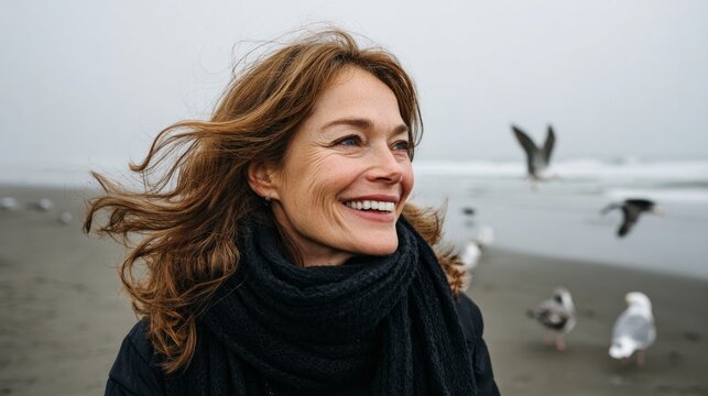 Smiling woman near beach and sea gulls.