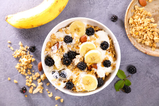 oats meal with fresh fruits and yogurt, granola, muesli for healthy breakfast