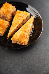 Baklava with pistachios and almonds dessert oriental sweets natural product tasty snack fresh delicious gourmet food background on the table rustic top view copy space