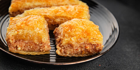 Baklava with pistachios and almonds dessert oriental sweets natural product tasty snack fresh delicious gourmet food background on the table rustic top view copy space