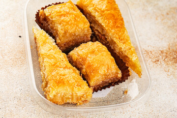 Baklava with pistachios and almonds dessert oriental sweets natural product tasty snack fresh delicious gourmet food background on the table rustic top view copy space