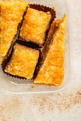 Baklava with pistachios and almonds dessert oriental sweets natural product tasty snack fresh delicious gourmet food background on the table rustic top view copy space
