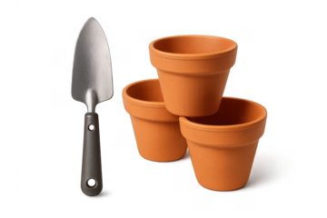 Gardening hand trowel and terracotta plant pots isolated