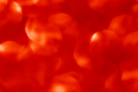 Red bokeh texture background. Christmas, New Year, Valentine, Chinese New Year and all celebration background concepts.