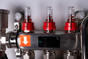 Complex residential heating manifold system with valves, gauges, and piping network