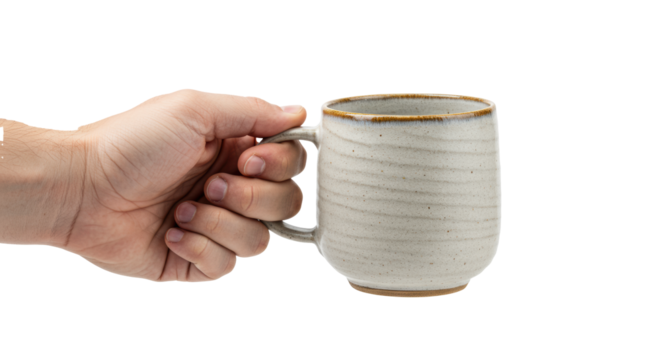 Adult light-skinned hand gripping a textured stoneware teacup with rustic brown trim, isolated on transparent in high-key studio lighting. Concept for artisanal drinkware advertising