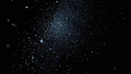 Obraz premium A view of outer space with numerous stars and cosmic dust particles scattered across the black background.