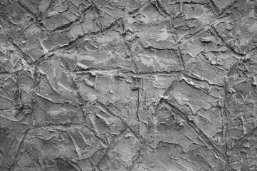 gray background, in the photo the texture of a gray wall with various lines, strokes and cracks