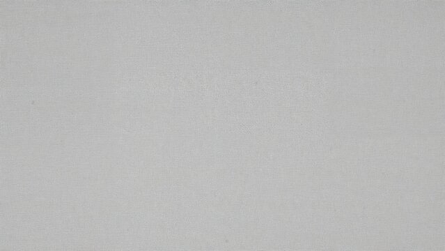 A plain, light grey textured surface with no additional objects or features.