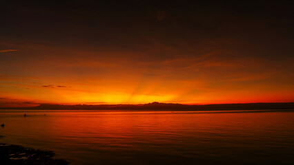 Stunning sunset over calm ocean waters