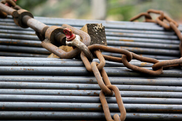 Heavy Steel Rods Secured with Chain for Construction Transport Safety