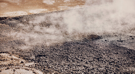 Hot fresh asphalt cooling down during city street reconstruction.
