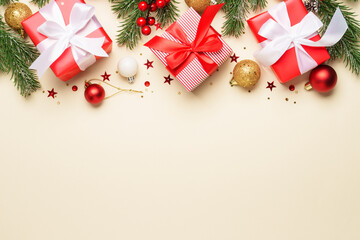 Christmas present, balls and fir tree branches.