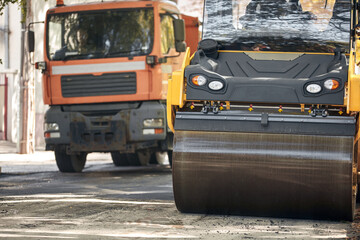 Public city street reconstruction with heavy machines.