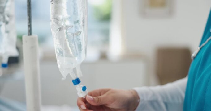 Nurse, hands and iv drip in hospital with liquid for medicine, patient treatment and hydration benefits. Healthcare worker, person and prepare intravenous bag with fluid, antibiotics and nutrients.