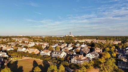 Aerial view of large mansion houses with swimming pool,  in affluent neighborhood  by Woodlands lake, Houston, Texas, expensive suburban homes surrounding by lush green trees, USA