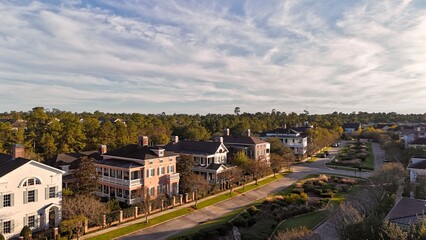 Aerial view of large mansion houses with swimming pool,  in affluent neighborhood  by Woodlands lake, Houston, Texas, expensive suburban homes surrounding by lush green trees, USA