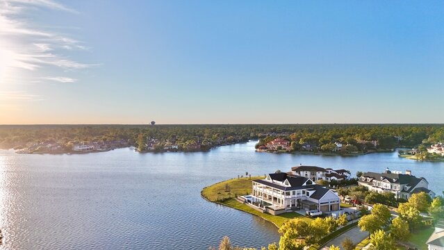 Aerial view of large mansion houses with swimming pool,  in affluent neighborhood  by Woodlands lake, Houston, Texas, expensive suburban homes surrounding by lush green trees, USA