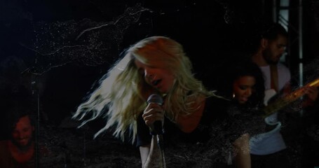 Chorus sending lead singer whipping hair and mic-singing on music stage, animated lights accenting