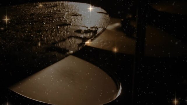 Camera panning revealing wet cymbals, droplets glistening, sparkles drifting, showing warm glints