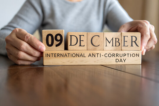 International Anti-Corruption Day image with wooden block calendar showing December 9 and awareness message generative ai