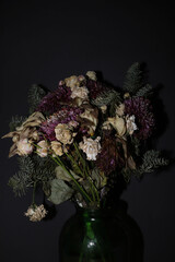 dried flowers of different flowers on a dark background