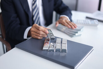 Silver Trading Businessman invest in trading silver, calculating profit price of  buying and...