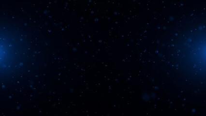 Obraz premium Abstract blue bokeh effect with floating particles on a dark background, perfect for digital designs and presentations