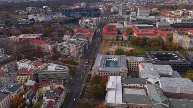 Aerial view revealing the Berlin Central Station in Moabit district, Spree River, and surrounding cityscape with urban traffic in Mitte
