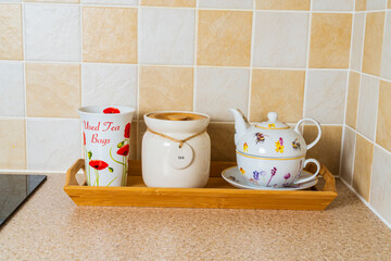 Teapot, tea caddy and container for used tea bags for preparing a cup of tea