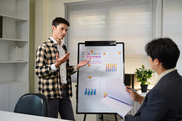 Pitching series photo, man presenting and pitching business ideas at boardroom