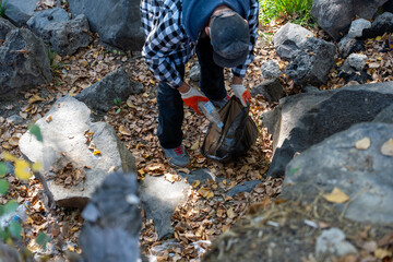 Volunteer Collecting Trash in Autumn Forest – Eco-Friendly Lifestyle and Nature Care