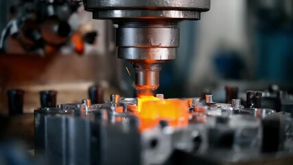 Closeup of a highpressure die casting machine injecting molten metal into a detailed mold showcasing automated precision in an industrial manufacturing setup.