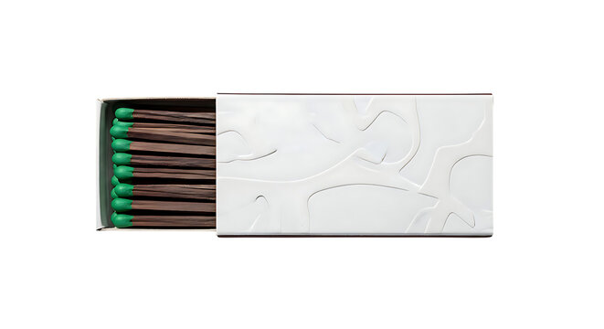 A box of matches with green tips is ready to be used for ignition.