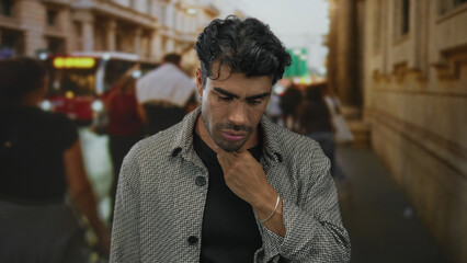 Man clutching throat with pained expression on crowded street in city center with blurred commuters and passing bus; discomfort.