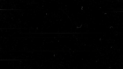 Black screen with dust particles and film scratches