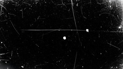 Black screen with scattered white scratches and dust overlay