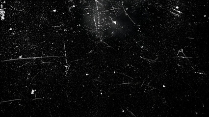 Grungy black background with white scratches and dirt